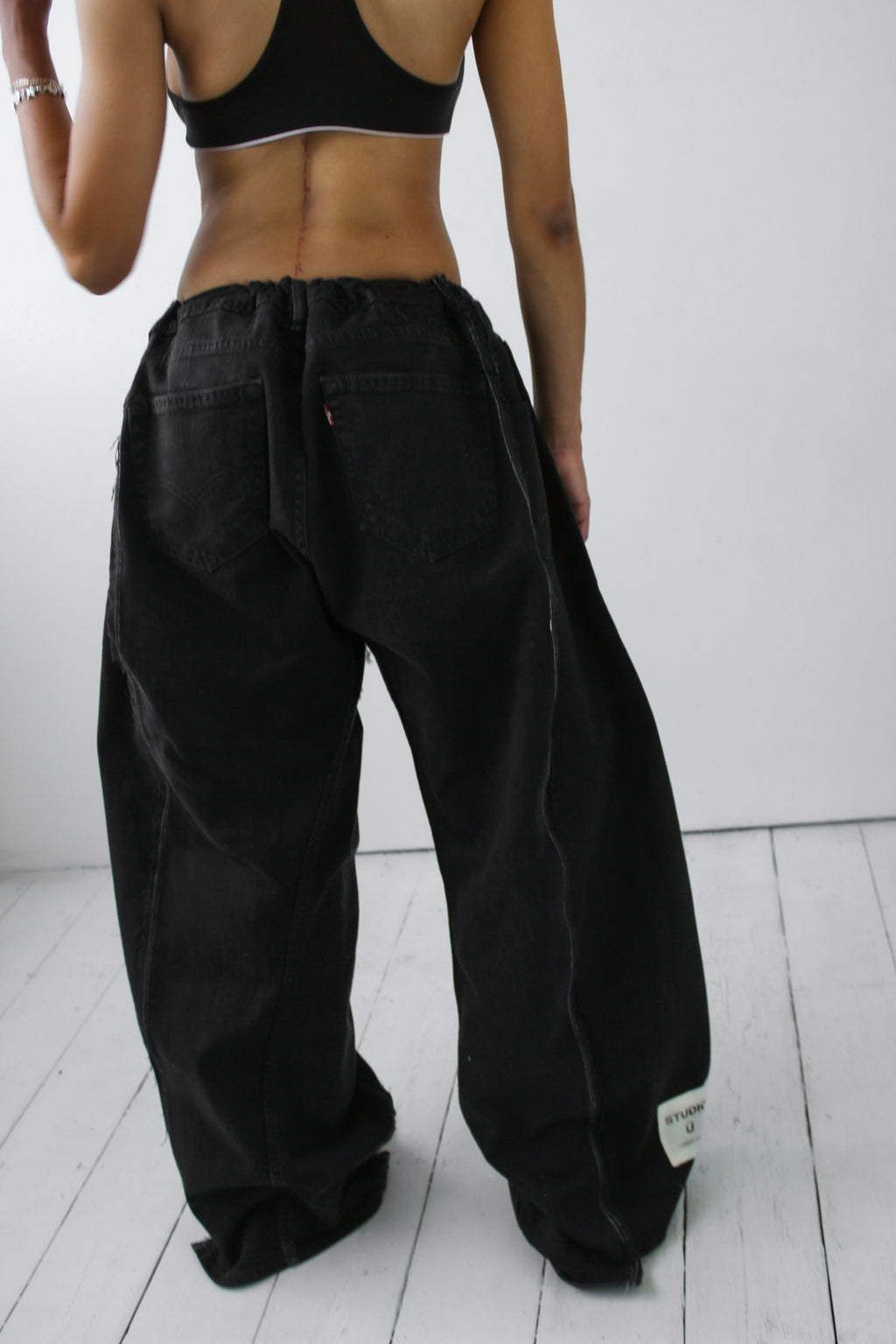 ARTISANAL WIDE BLACK DENIM TROUSERS